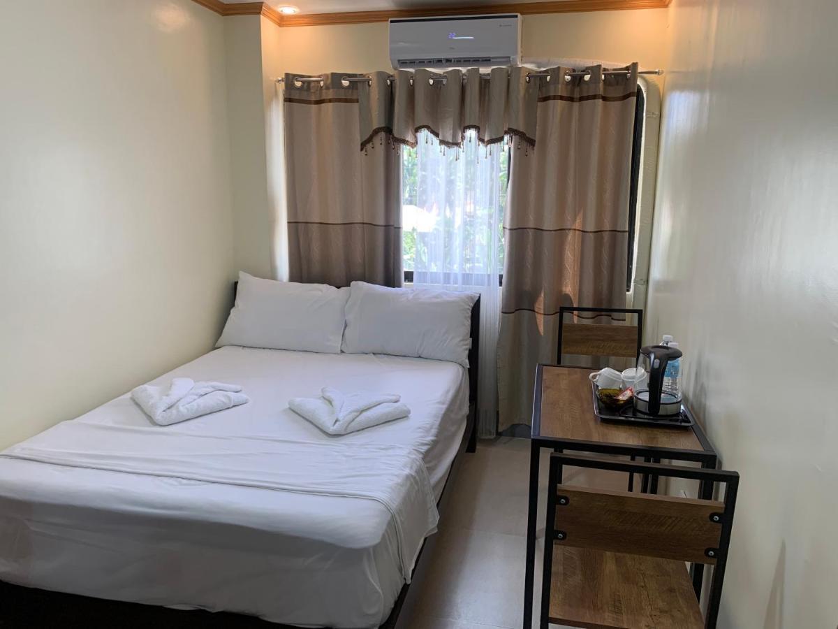 Zl Travelers Inn Batuan Exterior foto